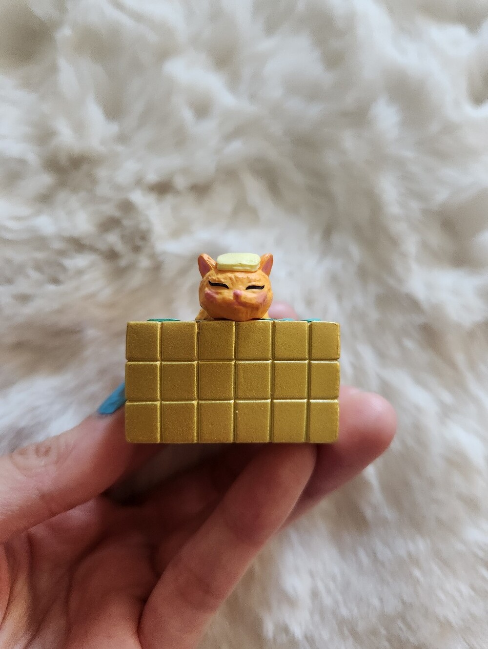 Little happy orange cat taking a bath figure I got from Japan
